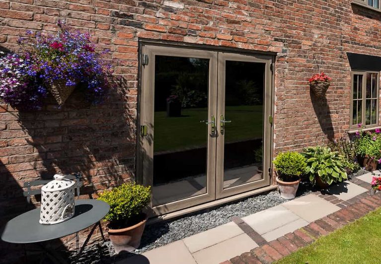 Large french doors in with wooden effect finish frame
